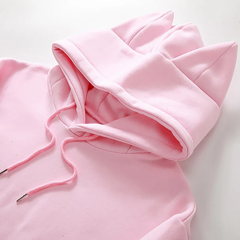Pink cat ear femboy hoodie close-up shot, soft kawaii aesthetic drawstring detail
