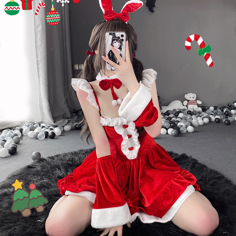 Close-up of the Christmas Femboy Kit, highlighting the intricate details of the red velvet dress with white faux fur trim, bunny ears, and bow decorations, set against a festive background with Christmas-themed elements.