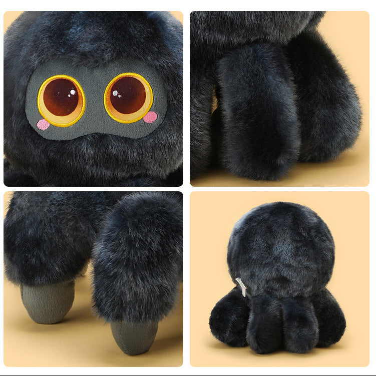 Close-up front view of a dark grey cute spider plush featuring oversized glossy eyes with yellow rims, soft fluffy fur texture, and embroidered pink cheek details on a pastel yellow background.