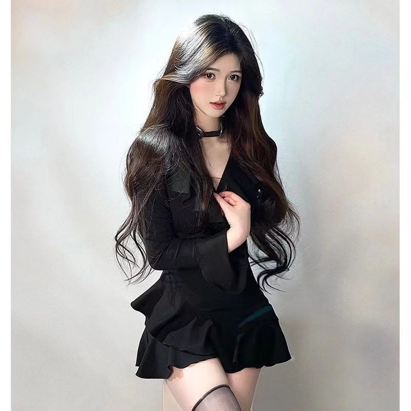 Full-body shot of a model in a V-neck black dress with flared ruffle sleeves, embodying a blend of elegance and alternative femboy fashion. The dress is perfect for layering and accessorizing during cooler seasons.