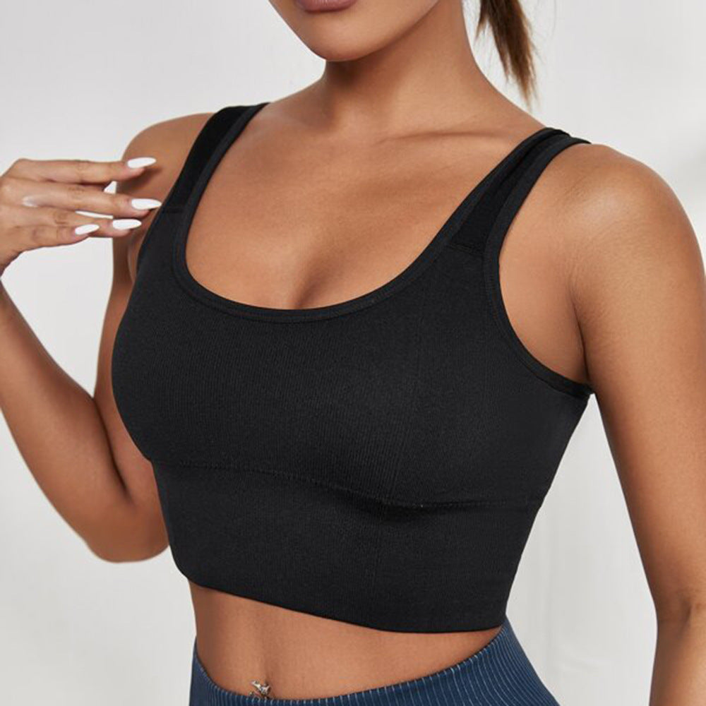 Front view of a model wearing a black Seamless Sport Bra, paired with blue high-waisted leggings. This sporty ensemble is perfect for achieving a chic, athletic look in femboy outfits.