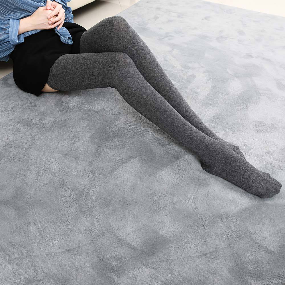 full body seated shot of dark grey extra long cotton femboy stockings, showing soft knit texture and high-thigh coverage suitable for femboy fashion looks