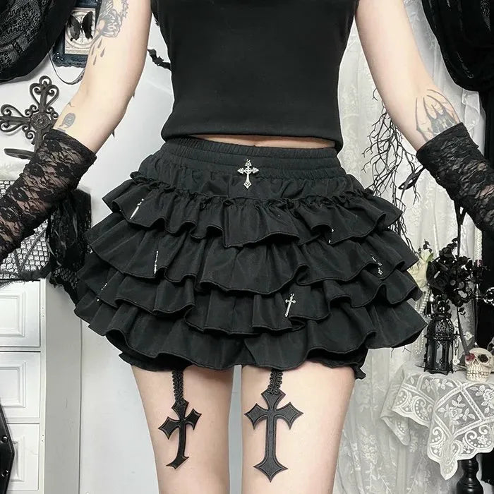 Black layered ruffle mini skirt for goth femboy outfits, dark aesthetic lifestyle shot with cross detail