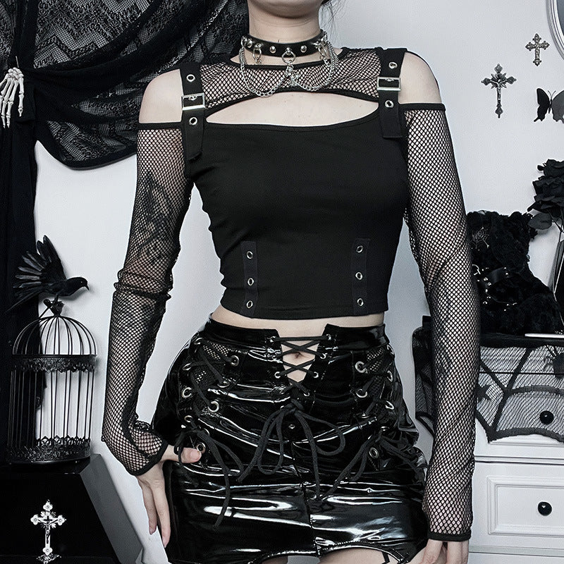 Front view of a gothic-style long sleeve crop top with fishnet sleeves, paired with a shiny black lace-up mini skirt, highlighting dark punk fashion aesthetic.