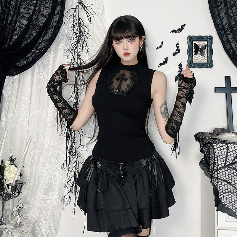 eye-level medium full-body shot of a model wearing the Gothic Cross Mesh Vest and layered black skirt in a gothic-decor room with lace curtains and candlelight, showcasing a cute femboy outfit.