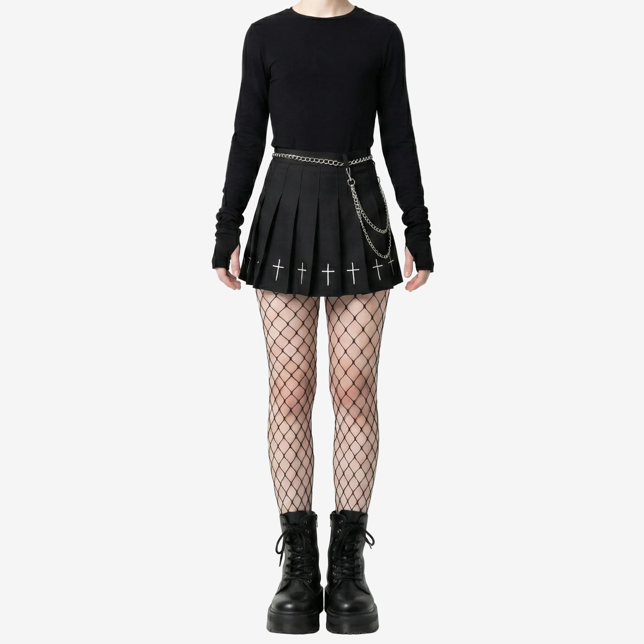 Full-body straight-on studio shot of a gothic femboy outfit featuring a black long-sleeve top, pleated cross skirt, fishnet stockings, and platform boots against a white background, showcasing edgy gothic femboy fashion and complete femboy outfit styling