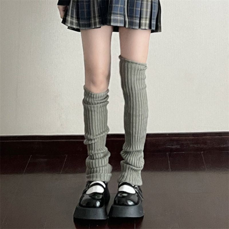 Front view of gray Knitted Leg Warmers worn with a plaid skirt, offering a casual, slouchy fit for a cool femboy look.