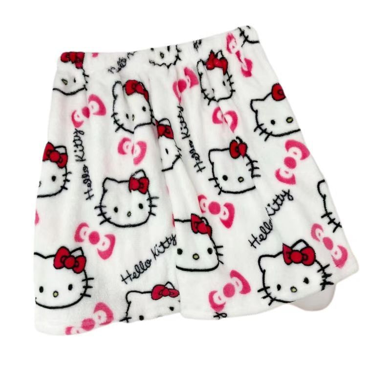 Flat lay product shot of white plush Hello Kitty print shorts with large Hello Kitty faces, pink bow icons, and “Hello Kitty” text; elastic waist; isolated on a white background for femboy clothing and femboy fashion.