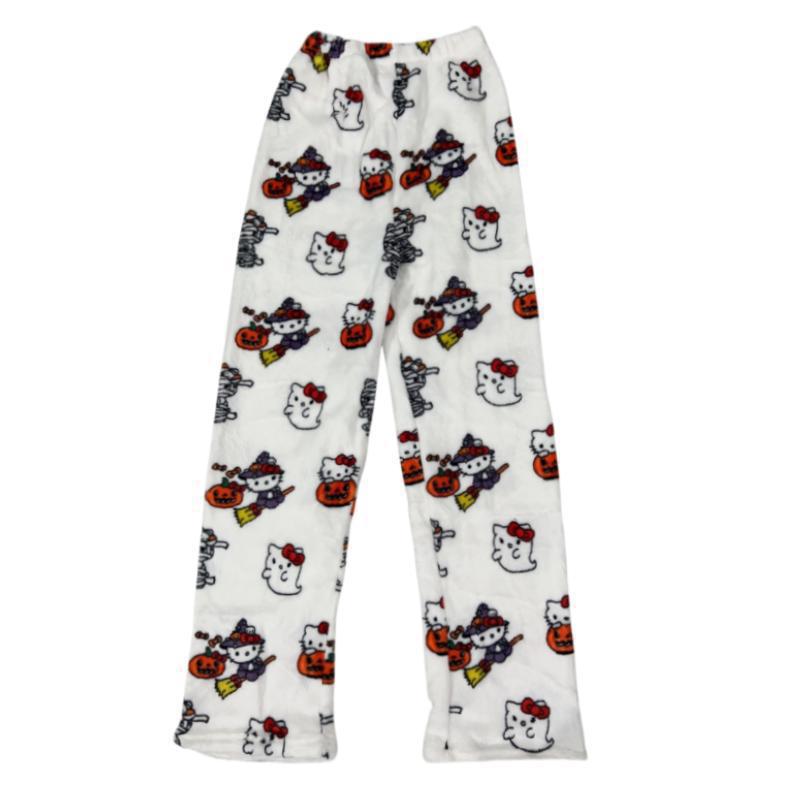 White Hello Kitty pajama pants displayed flat on a white background, featuring Halloween-themed prints with pumpkins, ghosts, and witch costumes, soft plush fabric ideal for playful femboy fashion and sleepwear.