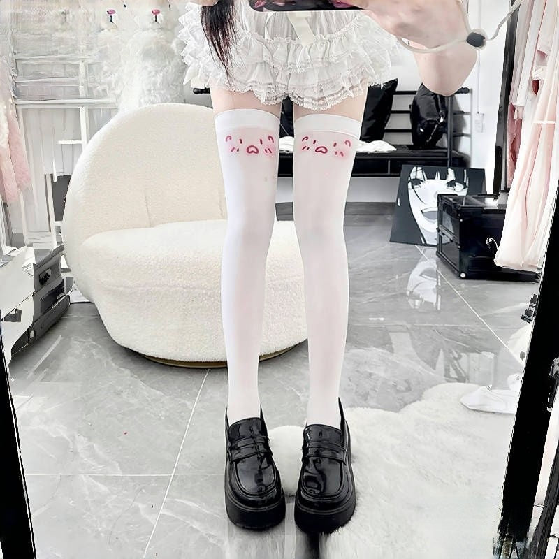 White kaomoji print over-knee socks with dazed OVO face print at the thigh