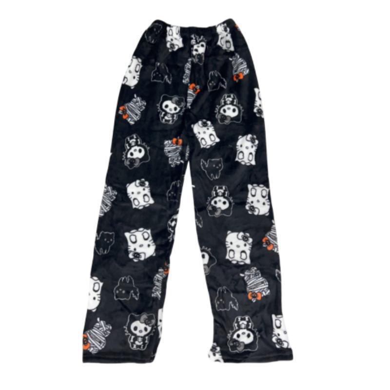Black fleece pajama pants with Kuromi and Hello Kitty Halloween-themed character prints, shown flat with elastic waistband and loose fit, designed for cute gothic-inspired femboy loungewear.