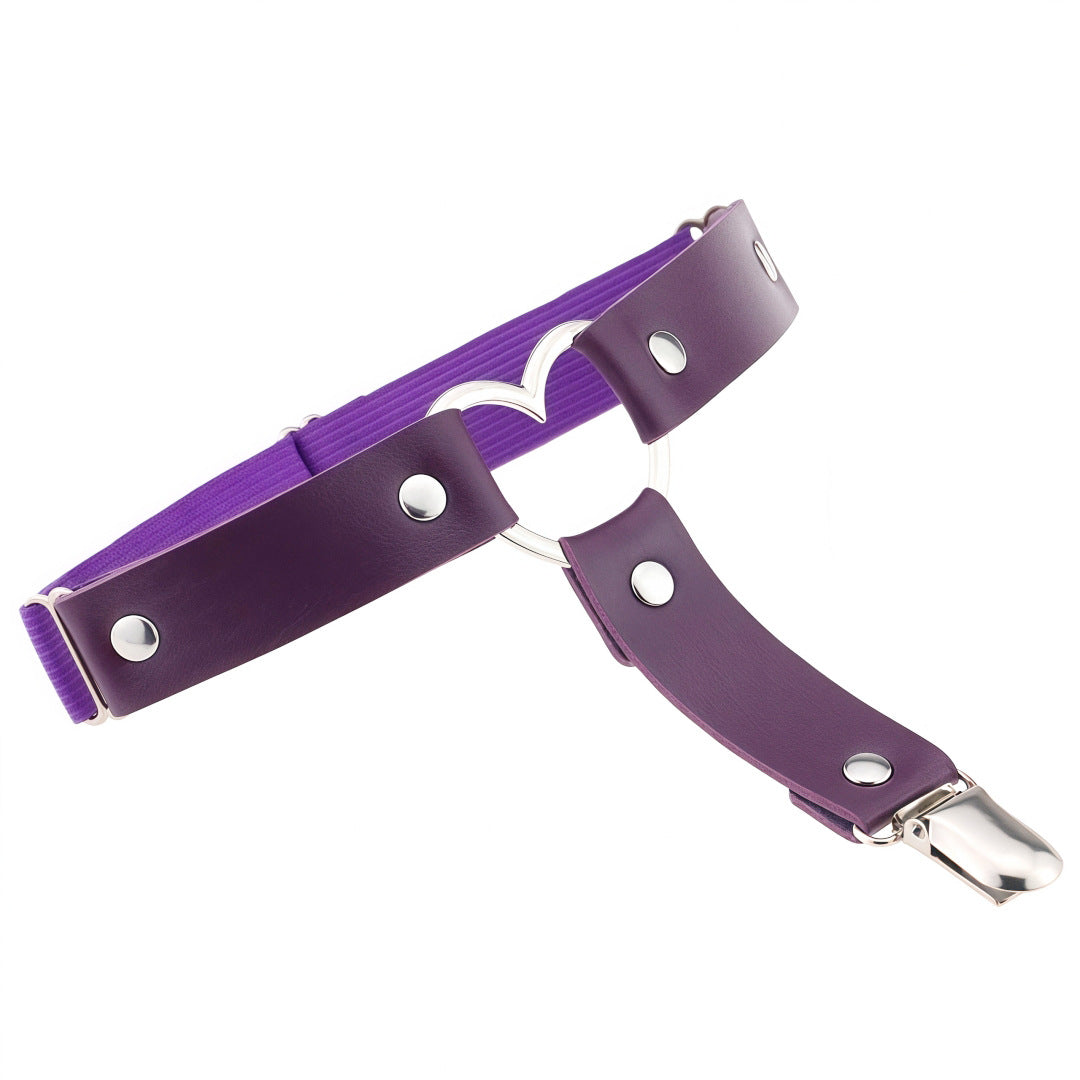 Purple leather heart femboy thigh garter featuring metal heart centerpiece and adjustable elastic band, soft femboy fashion accessory