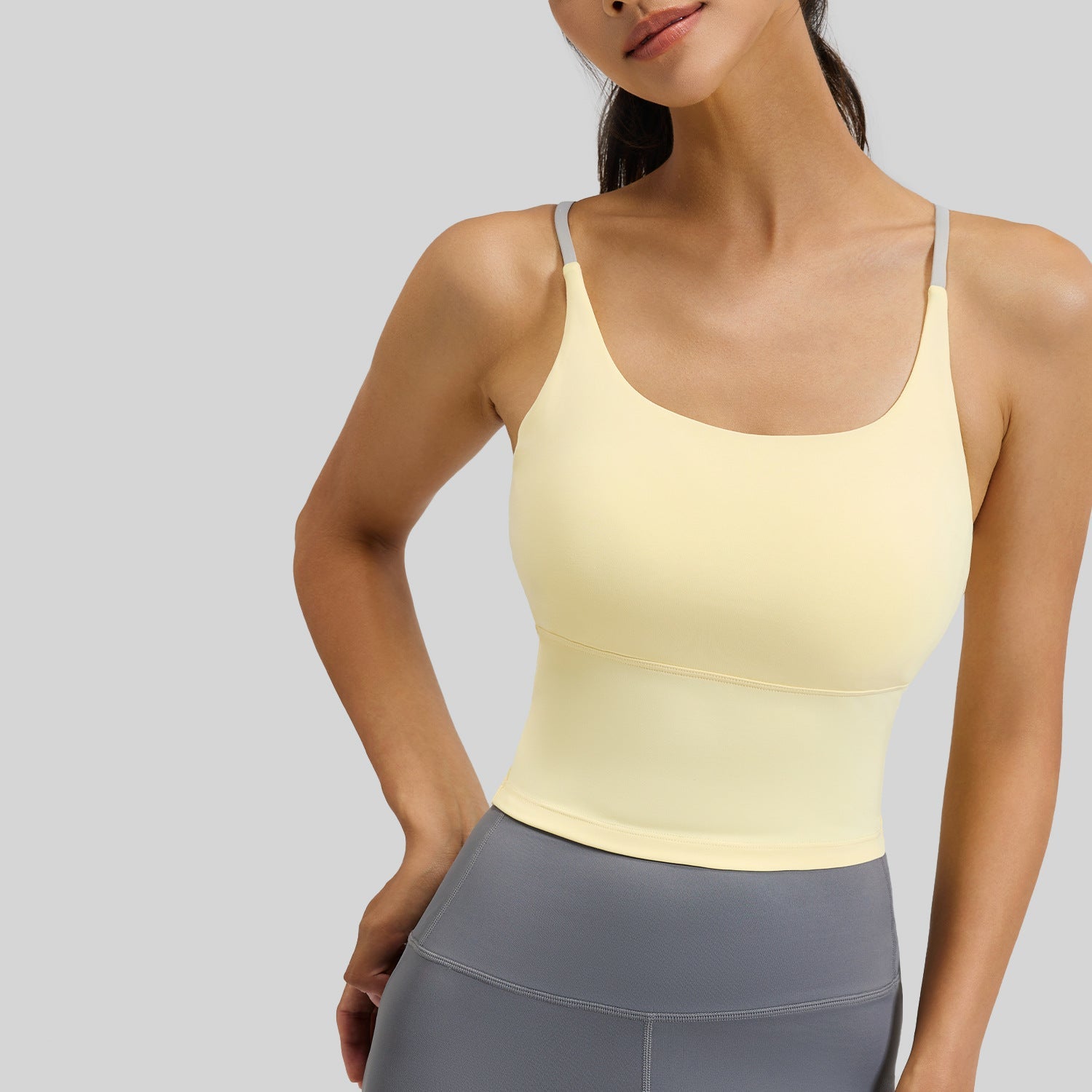 Femboy sports bra yellow padded strappy cross back seamless on model