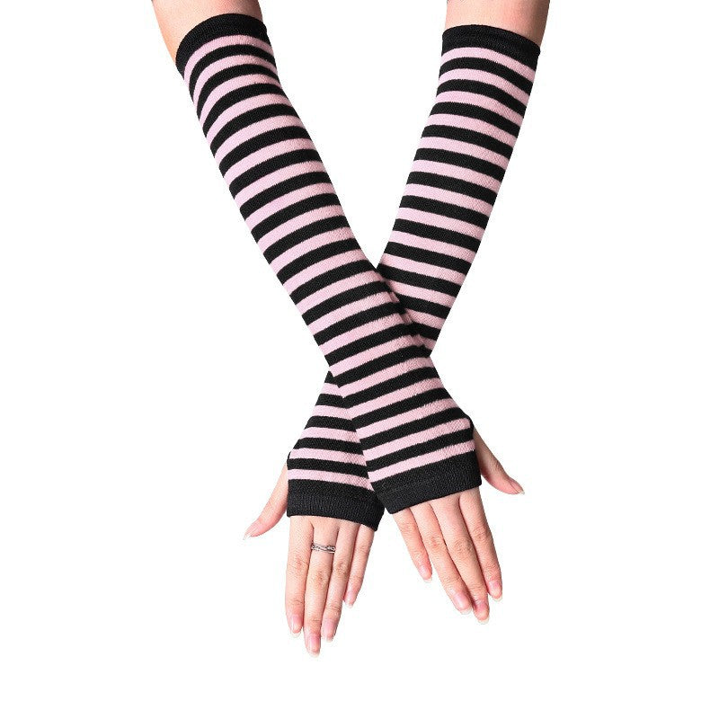 Pink and black striped femboy arm warmers product shot, goth aesthetic fingerless sleeve