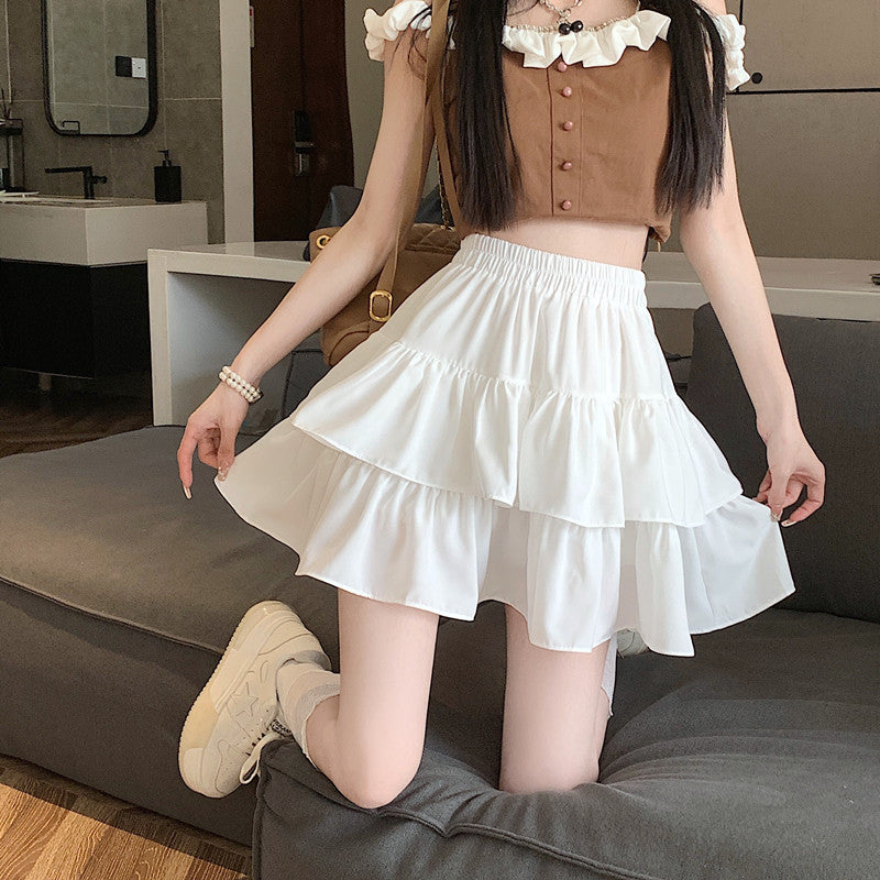 Front shot of a white High Waist Puffy Skirt featuring layered tiers, adding a light, airy touch to a modern femboy look.