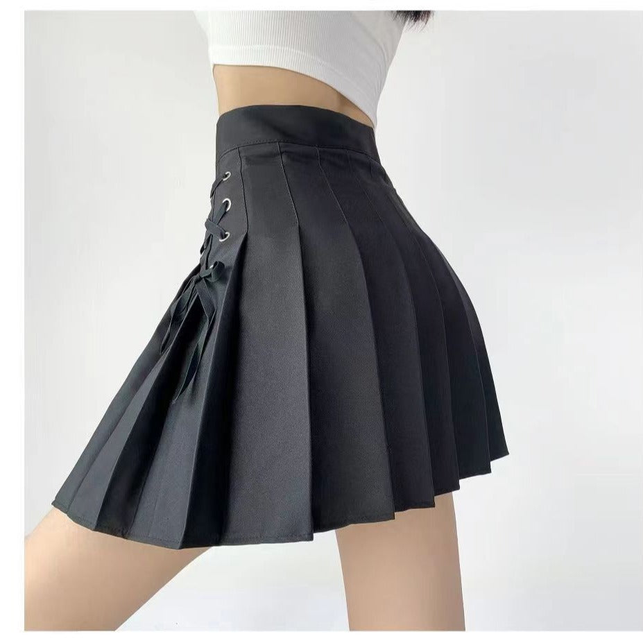 Side profile of the Bowknot Lace Plaid Skirt in black, showcasing pleated design and bowknot lace detail. A chic addition to femboy fashion and versatile femboy clothes.