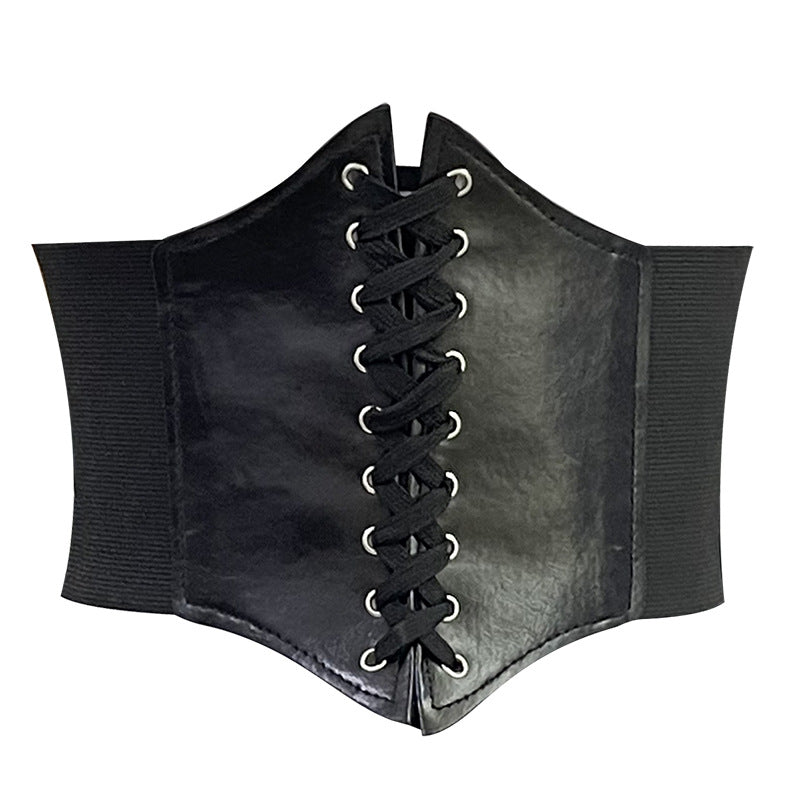 Close-up of a black corset-style cinch waist belt with lace-up detailing, designed to enhance femboy outfits and provide a fitted look. Perfect for adding a bold touch to femboy clothing and fashion.