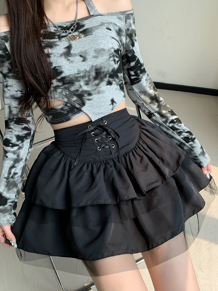 Waist-level view of a black ballet-inspired short skirt with layered tulle, enhancing femboy style with elegant and youthful vibes.