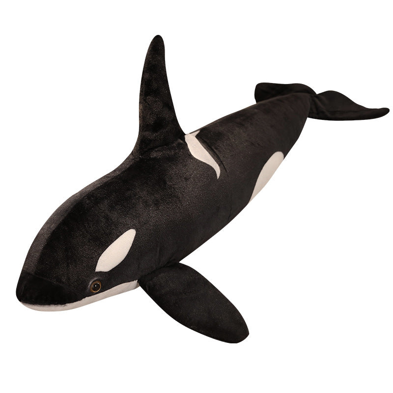 BLÅVINGAD orca plush shown on a white background, featuring detailed black and white coloring, upright dorsal fin, and elongated body pillow design.