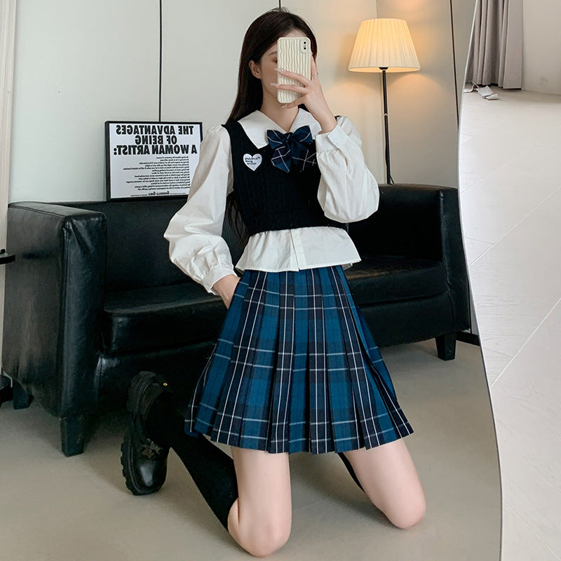 Fashionable outfit featuring a blue plaid femboy student skirt, styled with a collared shirt and bow, showcasing a modern twist on classic school fashion for femboys.