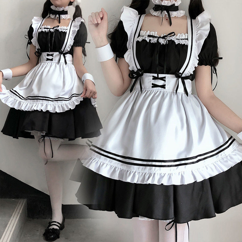 Elegant femboy clothing with a black and white maid costume, complete with puffy sleeves and contrasting trims, ideal for a fashionable themed appearance.