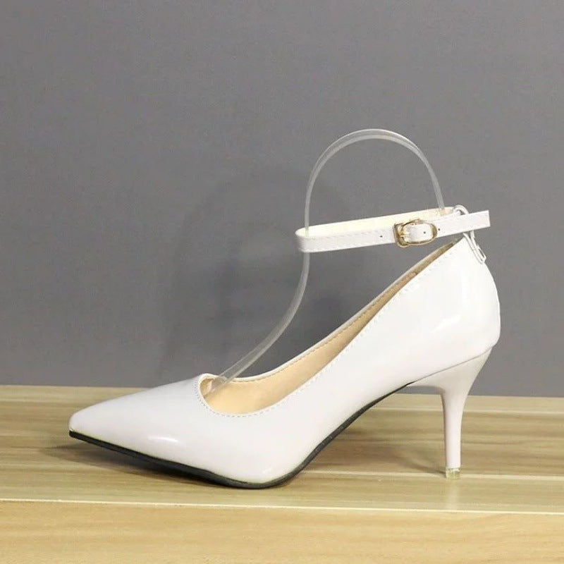 Elegant white leather heels showcasing a minimalist design with an ankle strap and pointed toe, ideal for versatile femboy clothing ensembles.