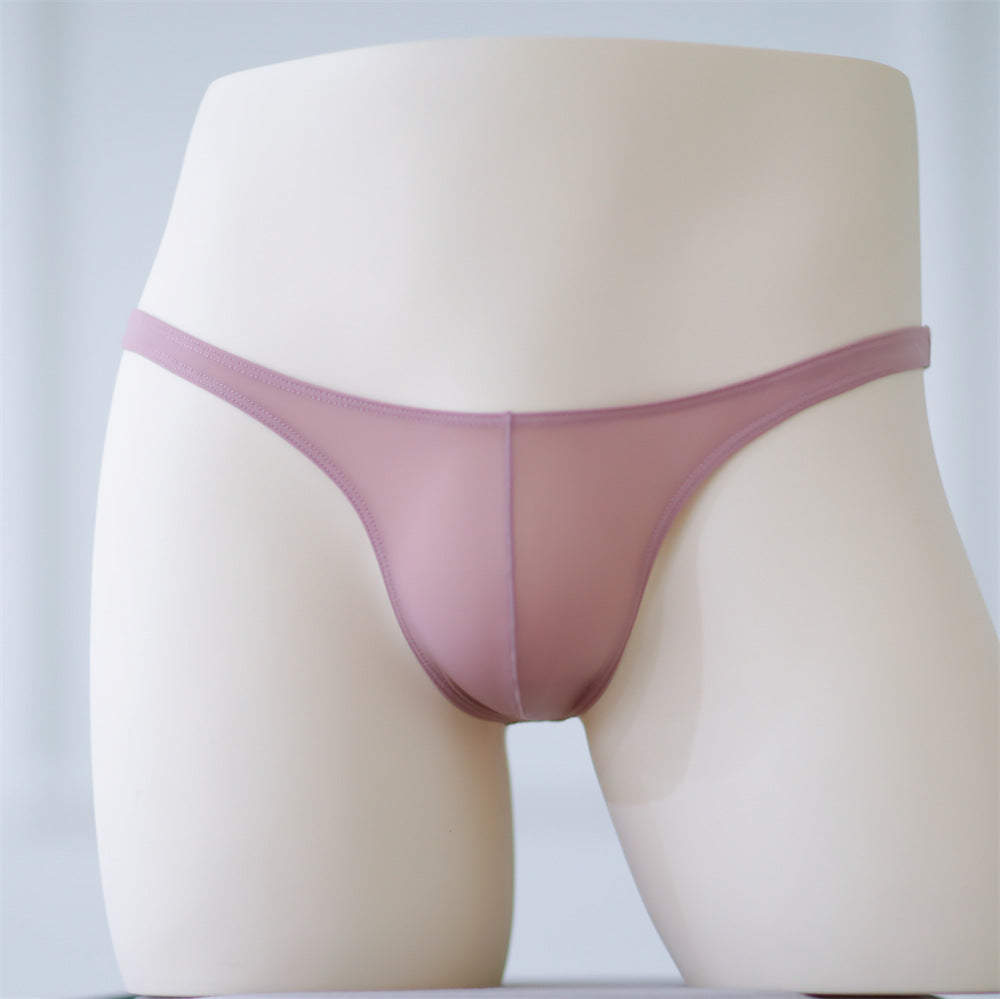 Front view of a biege see-through femboy G-string displayed on a mannequin, highlighting the delicate and daring design. Ideal for femboy fashion and stylish femboy clothing collections.