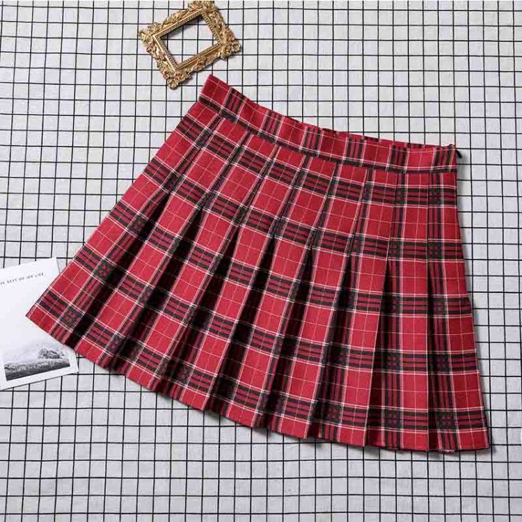 Rich red plaid pleated skirt on display, a bold choice for those embracing femboy clothes with a classic twist.