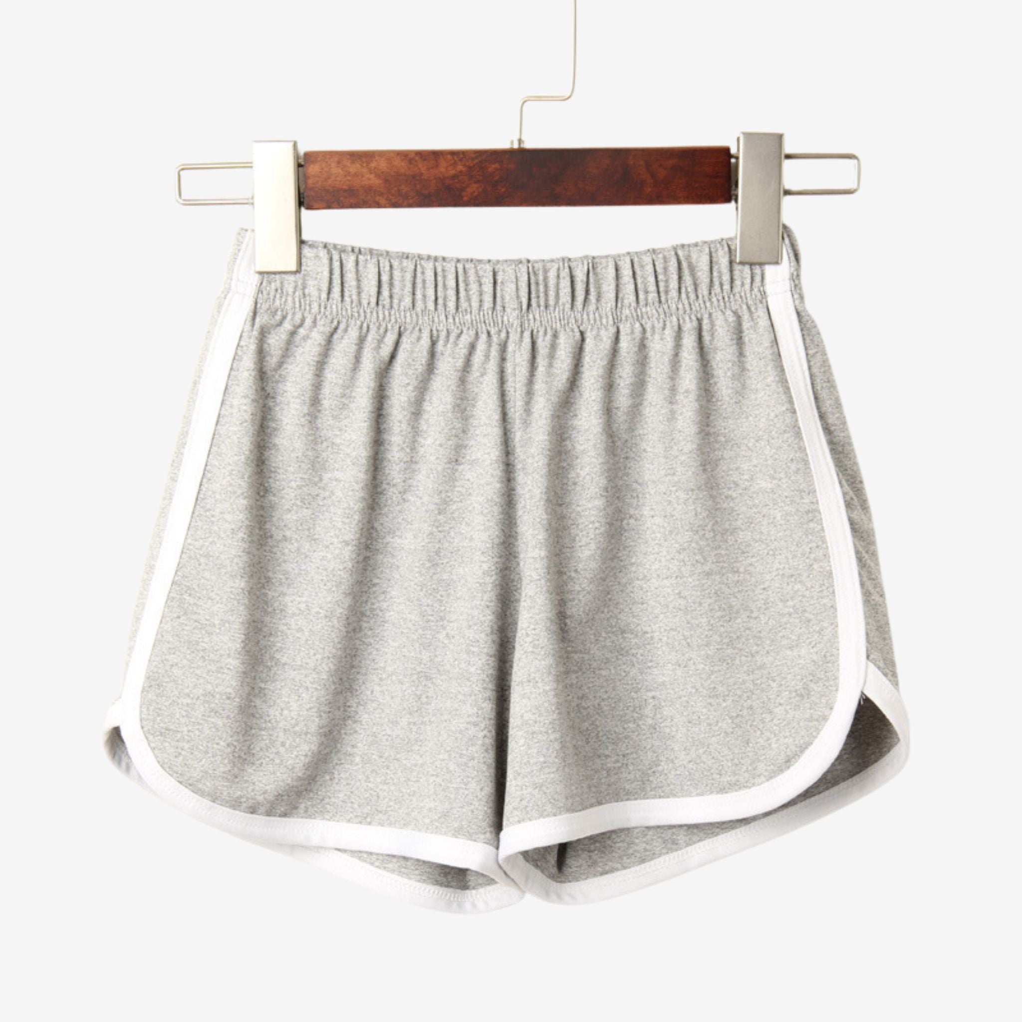 Grey Dolphin Shorts with white piping, captured in a flat-lay style on a white surface. Designed for comfortable and stylish femboy clothing.