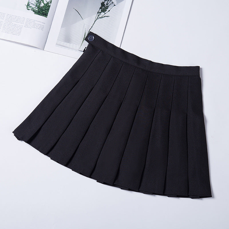 Elegant black high-waist pleated mini skirt on a flat surface, demonstrating a sophisticated choice for those interested in femboy fashion.