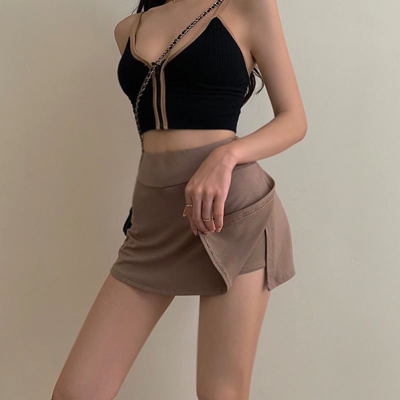 Close-up on the back of a brown Femboy Tennis Skirt, emphasizing the detailed pleats and high-quality fabric. The camera captures the texture and stitching, suitable for customers interested in sophisticated femboy clothing.