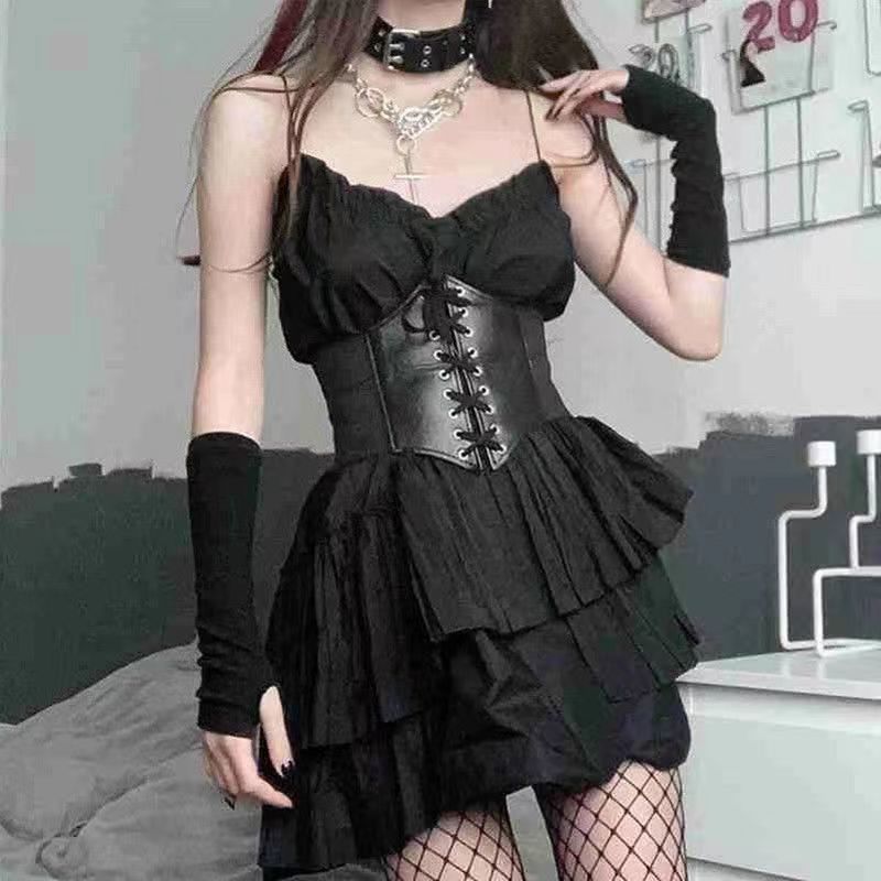 Full look of a black corset belt paired with a layered black dress, styled with fishnet stockings for a gothic-inspired femboy fashion look. Great for edgy femboy clothing styles.