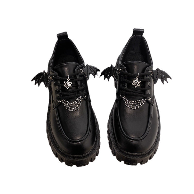 A pair of Gothic Lolita School Pumps on a white background, highlighting the winged embellishments and chain details with a star pendant, suitable for femboy outfits that blend elegance with a gothic edge.