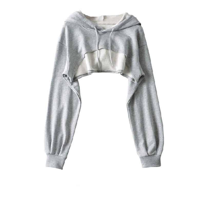 Front view of grey cropped femboy hoodie with loose fit and elastic cuffs – everyday casual femboy outfit, modern femboy fashion look