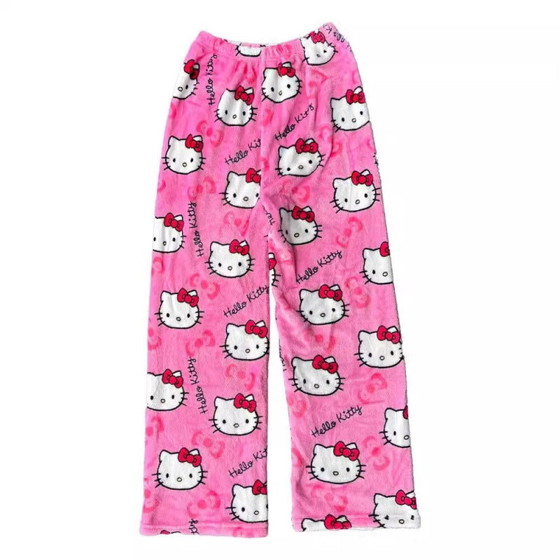 Pink Hello Kitty print femboy pants shown from an alternate flat lay angle, emphasizing the elastic waistband, plush texture, and playful Hello Kitty pattern on a clean white background.