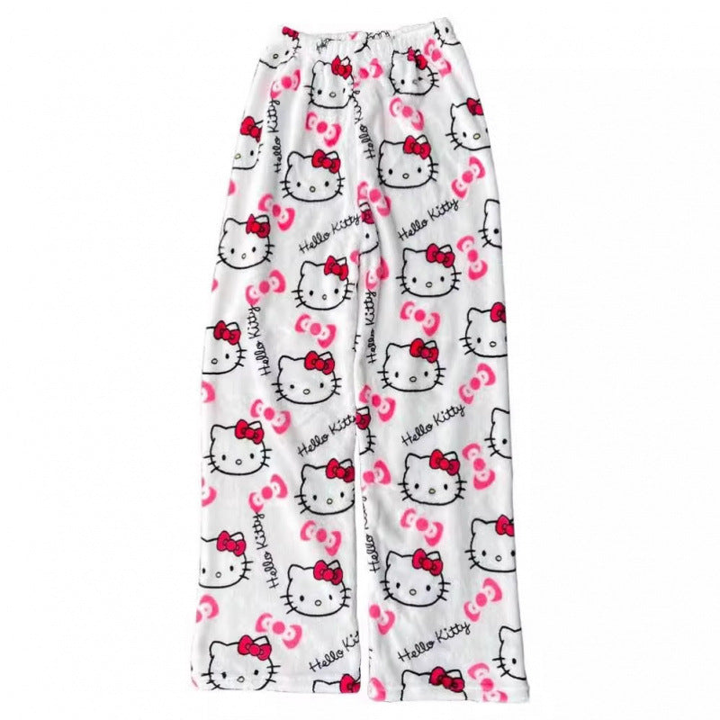 White Hello Kitty print femboy pants displayed in a flat lay view, highlighting the repeating Hello Kitty and bow pattern on cozy plush material with a loose, comfortable silhouette on a white background.