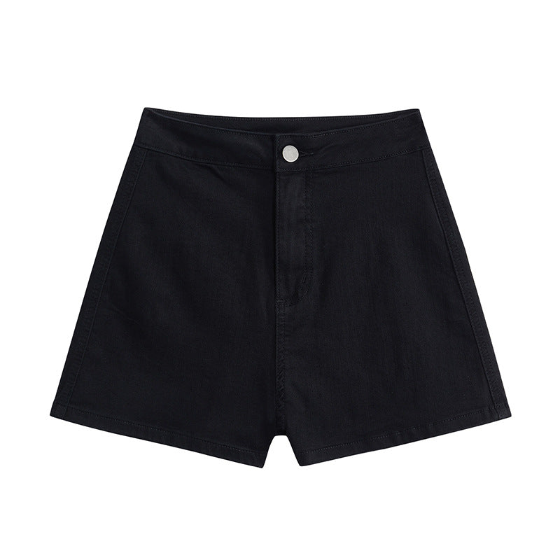 Flat-lay close-up of high-waisted black denim shorts against a plain white background. These minimalist high-waisted shorts are perfect for casual femboy outfits, offering a sleek and comfortable option for everyday femboy fashion. The durable black denim material and clean stitching highlight the modern and versatile design, making them an essential piece of femboy clothing.