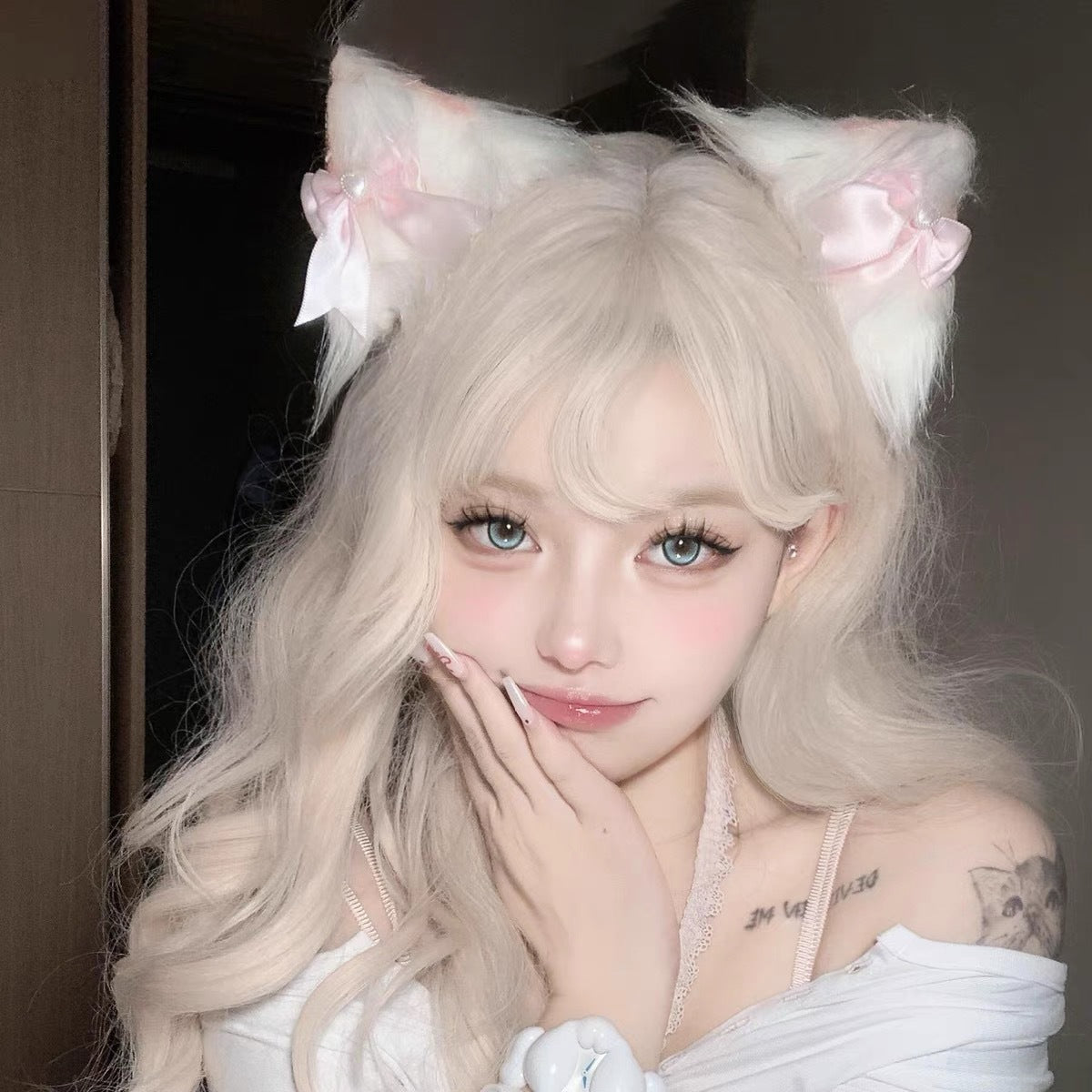 White and pink bow lolita cat ear clips worn with blonde hair, kawaii femboy hair accessory