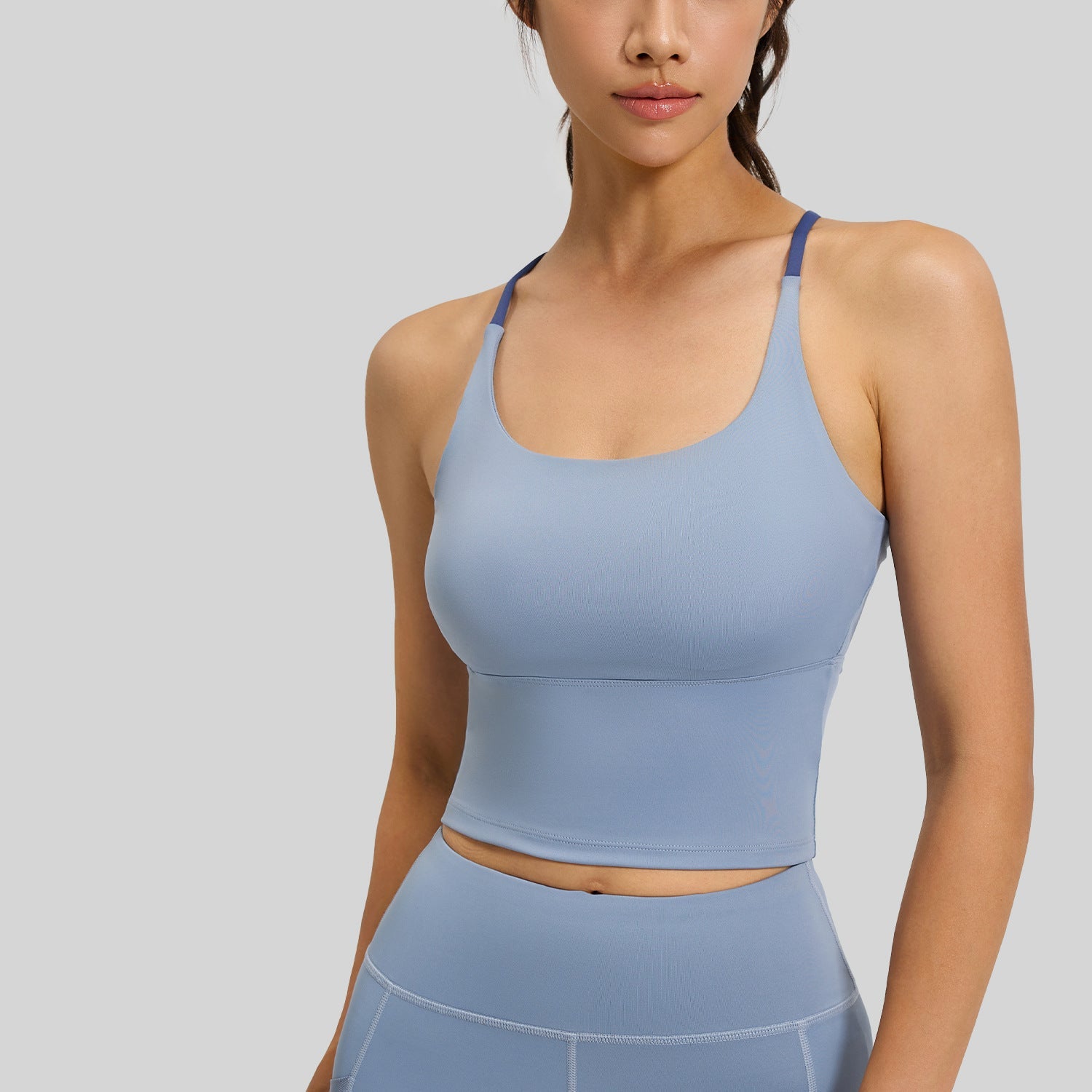 Femboy sports bra blue grey padded strappy seamless gym crop on model