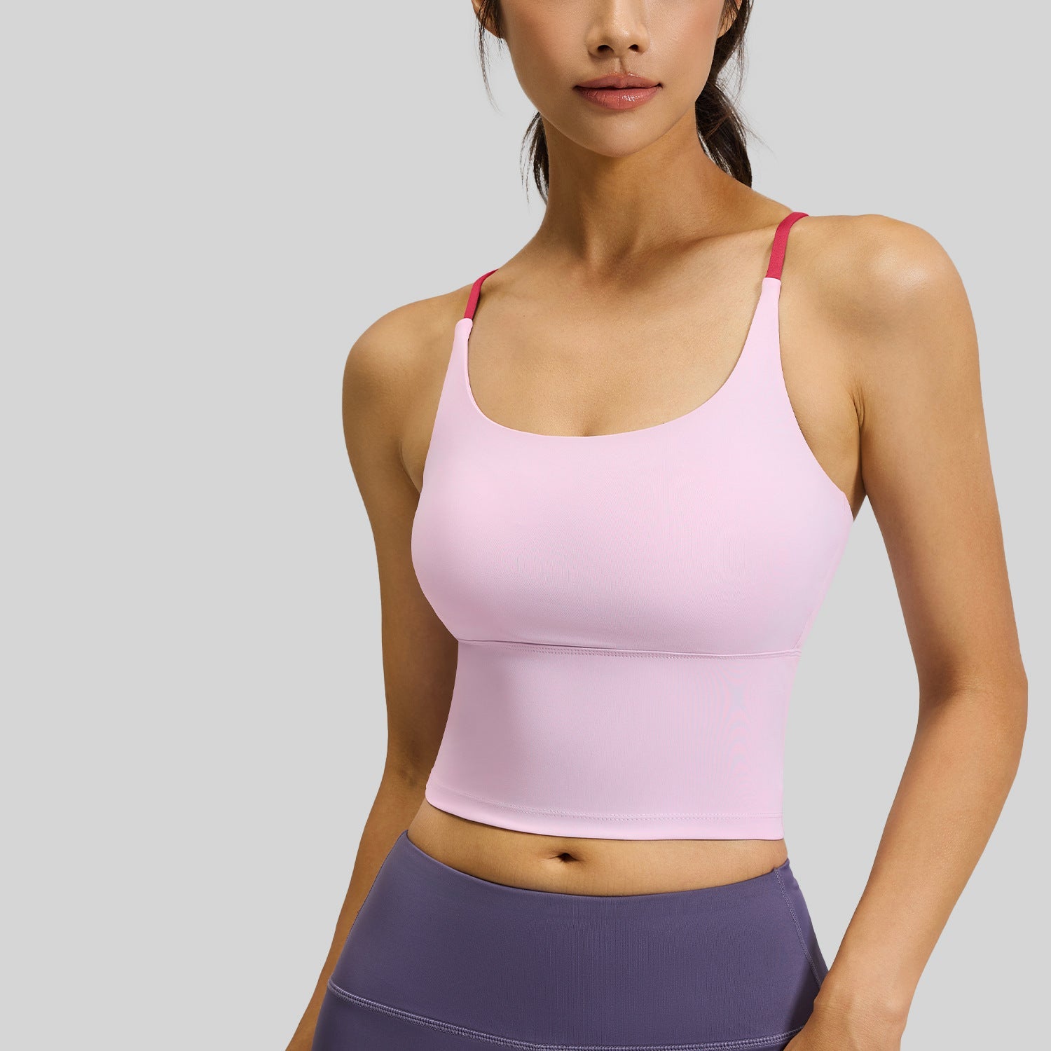 Femboy sports bra pink padded strappy cross back seamless on model