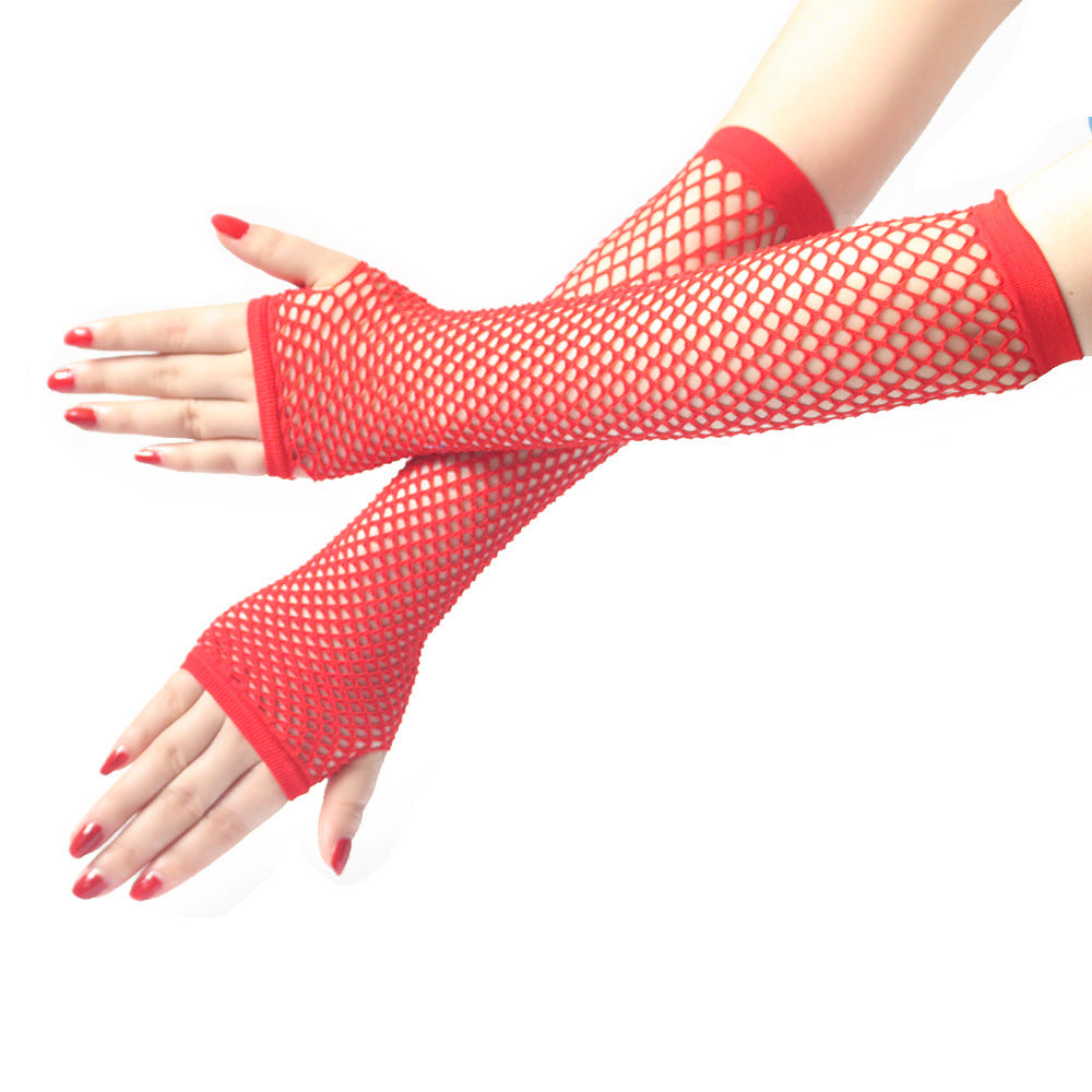 Red long fishnet sleeves worn on both arms with bright mesh detailing, styled with red nails for bold alternative and femboy fashion looks.