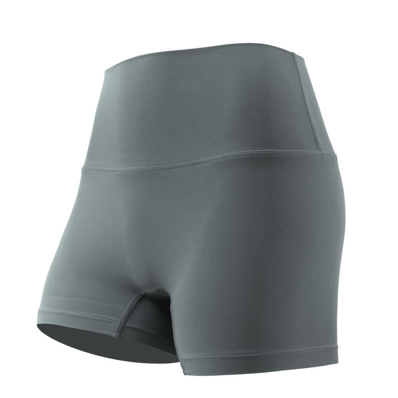 Close-up of slate gray yoga shorts, displaying a high waist and seamless sides, on a plain background. The focus is on the sculpting fit and the smooth texture of the fabric.