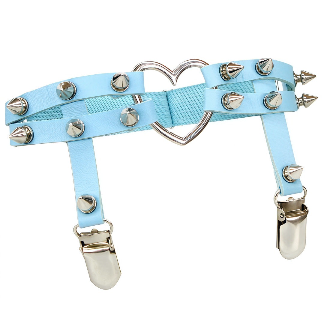 Studio product shot of the light blue Studded Heart Femboy Thigh Garter taken from a straight-on angle on a white background, featuring pastel blue faux leather straps, chrome spike studs, elastic banding, and a heart metal connector, ideal for soft pastel femboy looks.