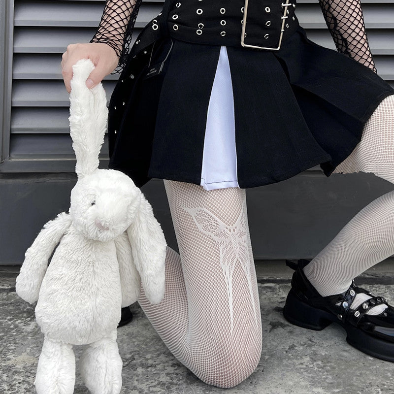 White gothic bow-knot fishnet tights styled with pleated skirt, showcasing delicate lace ribbon details and soft femboy clothing aesthetic